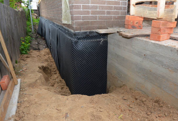 SJ Waterproofing Pros technician performing targeted Emergency Waterproofing assessment in Brooklyn, IN